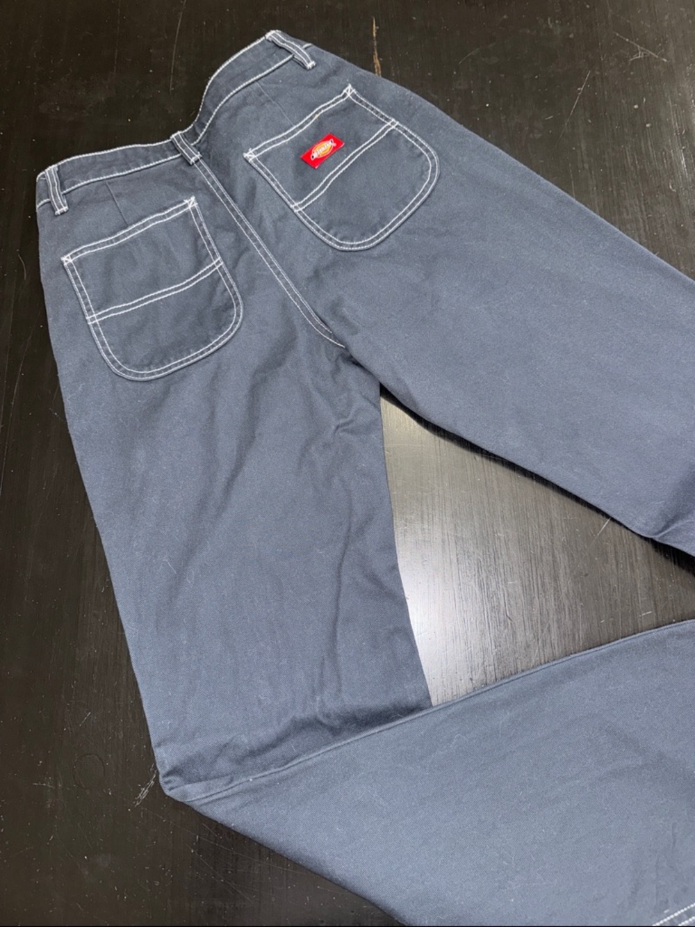 women’s juniors dickies pants. navy blue with white stitching. size 1/25.